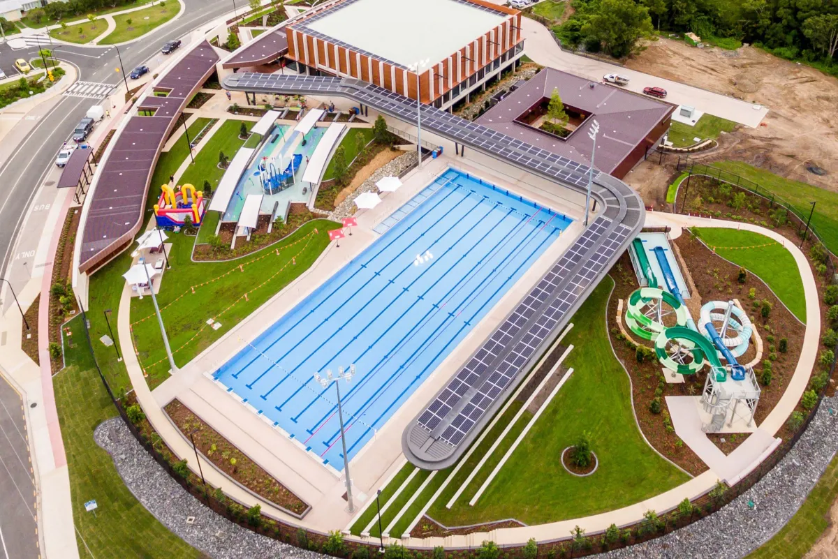 Gympie Aquatic Recreation Centre from the air: the outdoor 50 m pool, the centre building, splash park and water slides